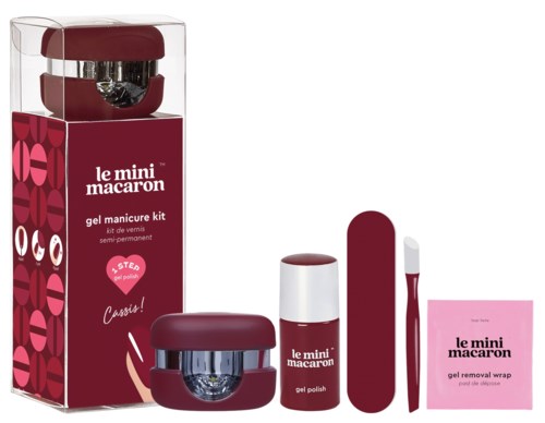 A compact manicure set with nail polish, a small file, and a remover, all in matching red and white colors.