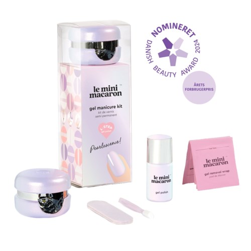 A pink nail care kit with gel polish, remover wrap, and a small container, displayed with awards and a clear box.