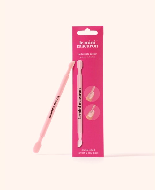 A pink nail file with a handle in packaging labeled 'le mini macaron' for nails.