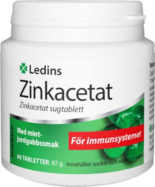 Valkoinen pullo Ledins Zinkacetat -tabletteja, vihreällä ja punaisella tarralla, mintin ja mansikanmaku ja immuunijärjestelmän tuki.