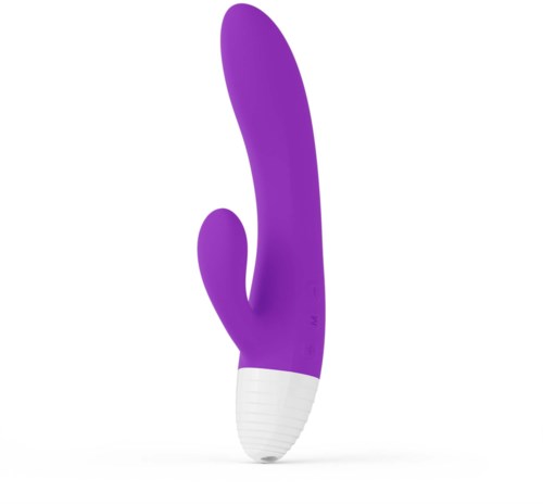 En lilla bøyd gjenstand med en hvit base, som ligner en moderne massasje- eller vibrator.