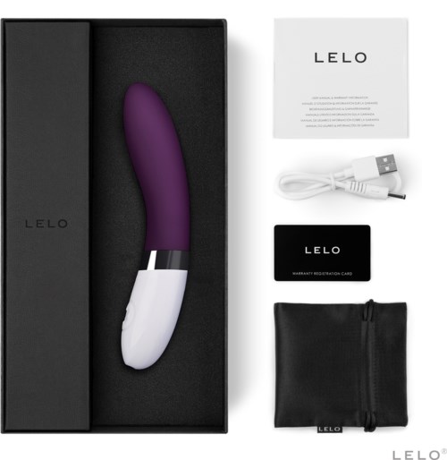 A purple and white curved device, a USB cable, a warranty card, a black bag, and a white paper are displayed.