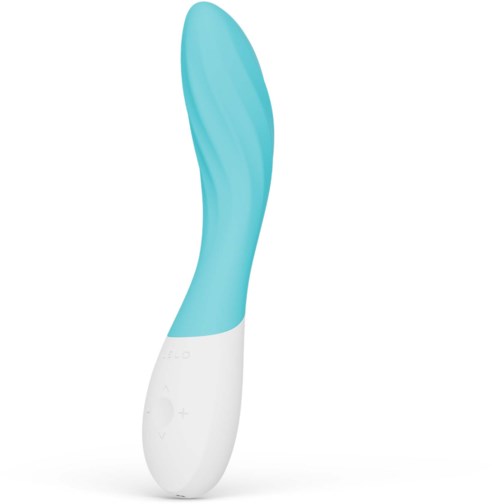 A light blue curved silicone facial massager with a white base and control buttons.