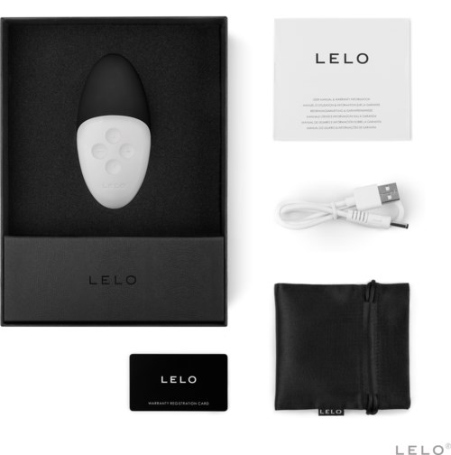 A white and black device with buttons, a USB cable, a warranty card, and a small black bag in a box.