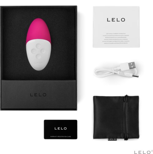 A pink and white device with buttons, USB cable, warranty card, small bag, and instruction paper.