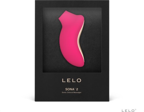 Ein pinkes und cremefarbenes Gerät in Beinform, mit der Aufschrift 'LELO SONA 2 Sonic Clitoral Massager,' in einer schwarzen Box.