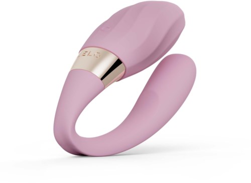 Pink silikonkosmetisk massasjer med glatt, buet design og gullfargede detaljer nær bunnen.
