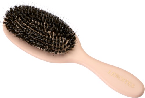 Eine weiche rosa Haarbürste mit schwarzen Borsten und dem Markennamen 'LEAOUITES' am Griff.