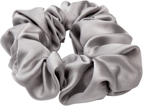 A silver, shiny fabric scrunchie in a circular shape with ruched material.