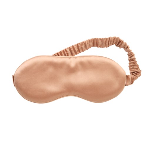 Beige-uninen silmämaski, jossa on joustava hihna silmien peittämiseen levossa tai unessa.
