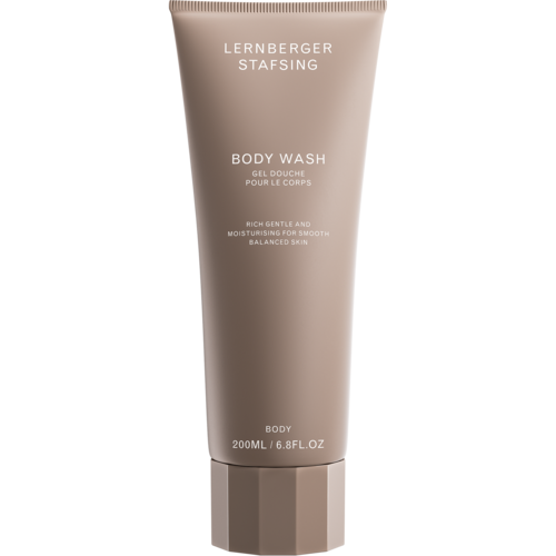 Een beige tube van LERNBERGER STAFSING body wash met tekst over zachte, hydraterende eigenschappen voor de huid.