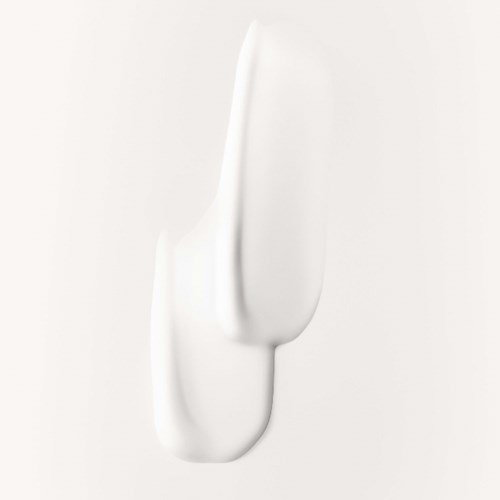 A dollop of white cream on a light background, smooth and shiny.