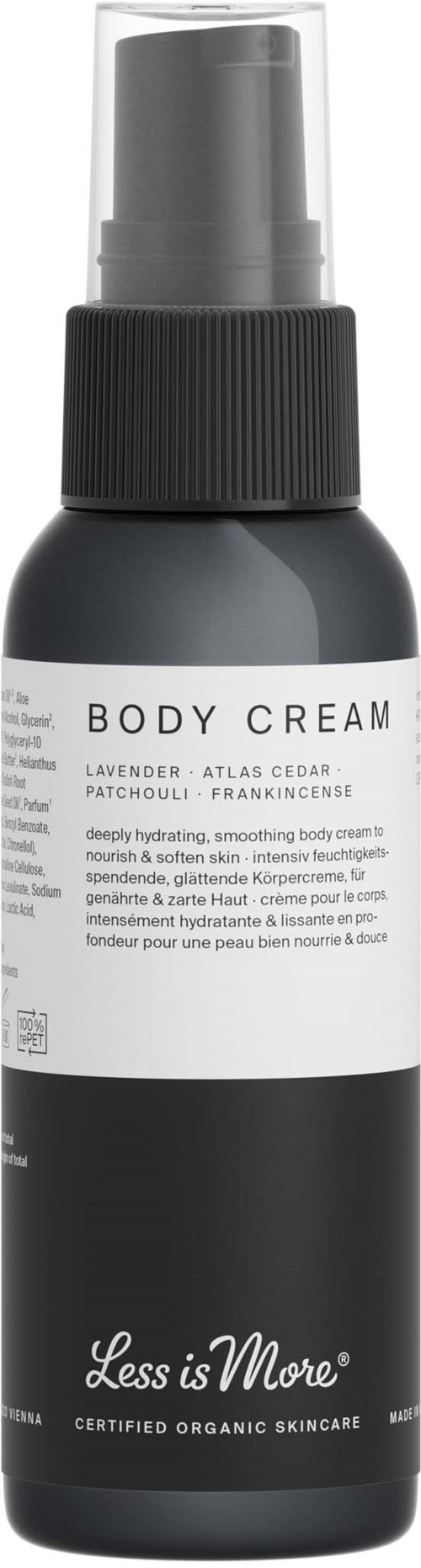 En sort og hvid flaske mærket 'BODY CREAM' med pumpe til hudpleje.