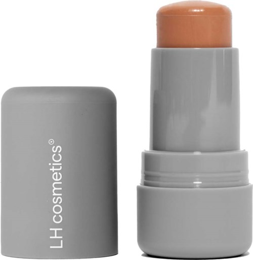 Een grijze fles met deksel, gemarkeerd 'LH cosmetics,' en een beige kleurige stick binnenin.