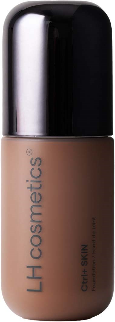 En flaske med flydende foundation med sort låg og beige emballage mærket LH cosmetics, Clear Skin, til jævn teint.