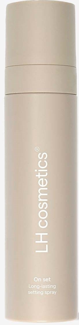 En vit cylindrisk flaska med beige lock, märkt 'LH cosmetics' och några produktbeskrivningstexter.