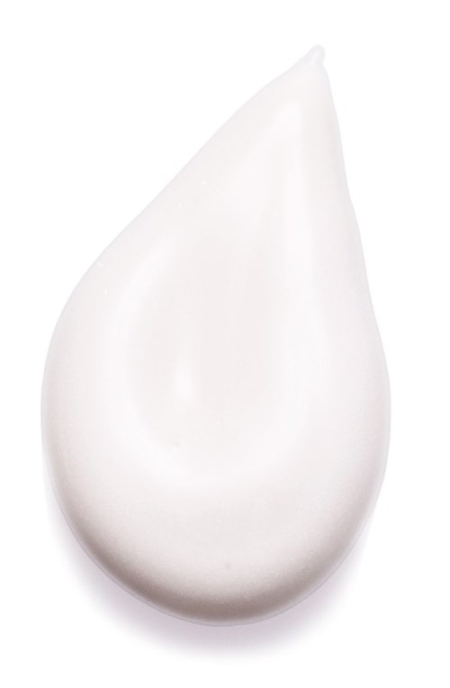 En vit, slät, tårformad sak, sannolikt en klick av grädde eller lotion.