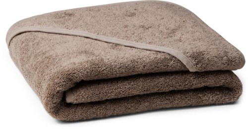 A folded brown towel with a white border, soft and plush, on a white surface.