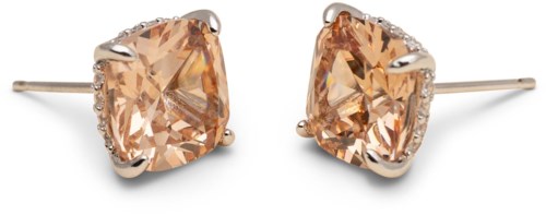 Elegant earrings with large, light orange gemstones and small sparkling accents, set in silver or white gold.