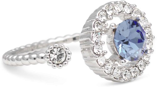 A silver ring with a large blue gemstone and small clear stones around it, with decorative design.