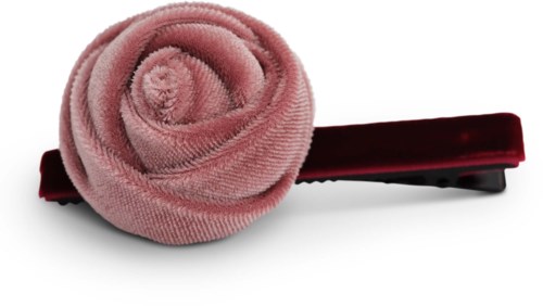 En rosa tygblomma med en svart klämma, liknande ett hårtillbehör.