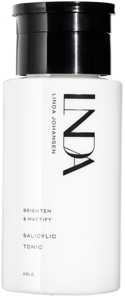 En hvid flaske med sort låg mærket 'Linda Johansen' og 'INDIA'. Den står 'Brighten & Mattify,' 'Salicylic Tonic,' 'Oslo.'