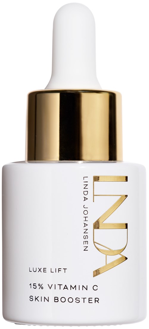 En vit flaska med guldlock och dropper, märkt 'LUXE LIFT 15% VITAMIN C SKIN BOOSTER' av Linda Johansen.