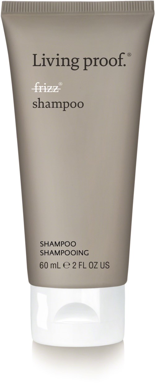 A beige tube of Living proof frizz shampoo, 60 ml, with black and white text, standing upright.