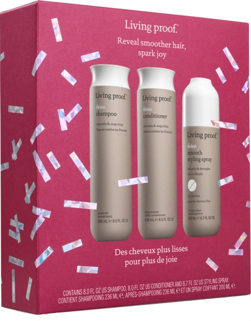 A pink box contains Living Proof hair care products: shampoo, conditioner, and styling spray, with confetti decorations.