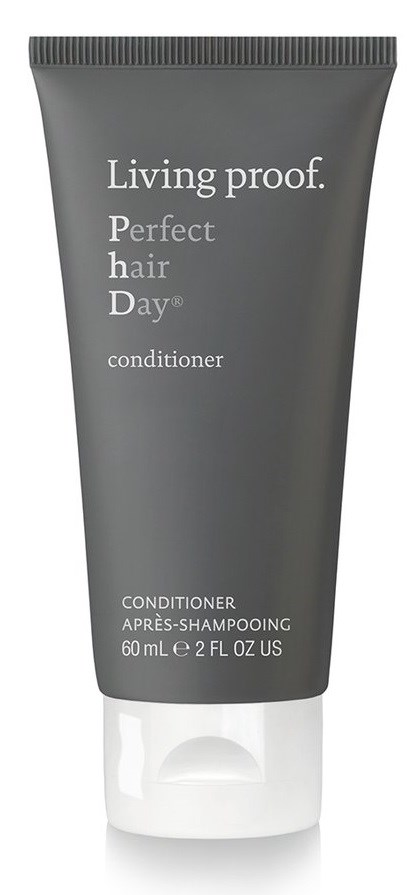 En grå tub med hårbalsam med vit text och vit lock, märkt "Living proof. Perfect hair day conditioner."