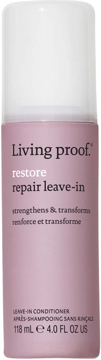 En rosa flaska med vitt lock, märkt Living Proof restore repair leave-in conditioner, 118 ml, för hår.