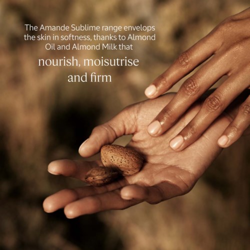 Close-up of hands holding almonds and almond nuts with soft background, highlighting skincare ingredients. Text on image describes nourishing properties.