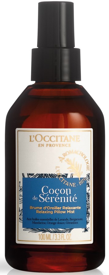 En brun flaske med sprayhode, merket 'L'OCCITANE' og 'Cocoon de Sérénité' for en avslappende pute mist.