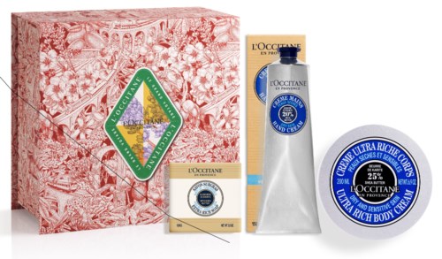 Beauty products, soap, cream, and a decorative pink box with a green logo. The items are arranged neatly.