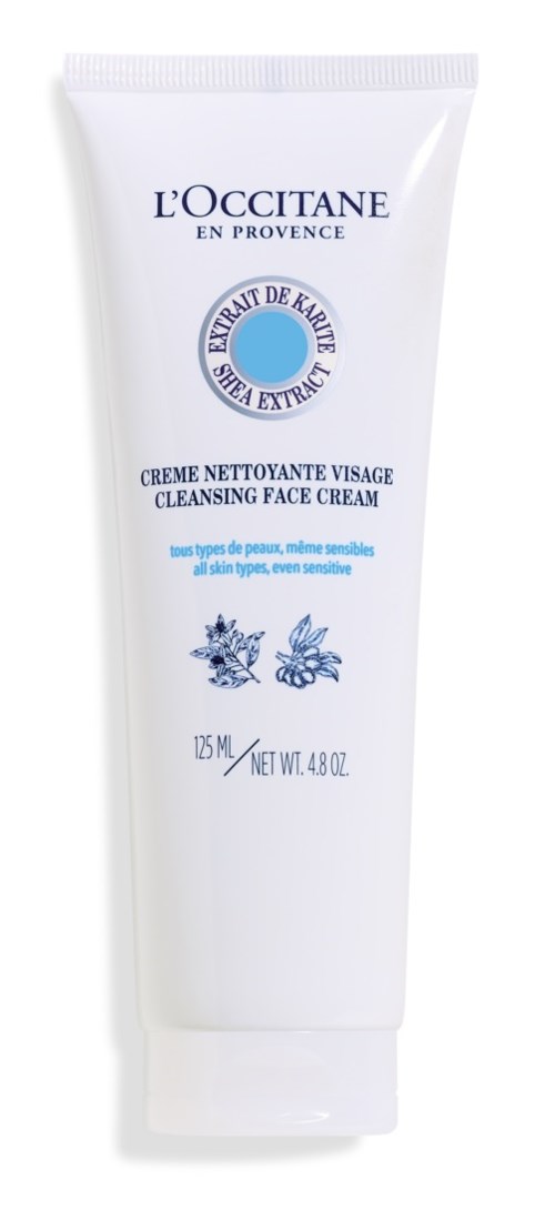 A white tube of face cleansing cream from L'Occitane, with blue text and herbal illustrations.
