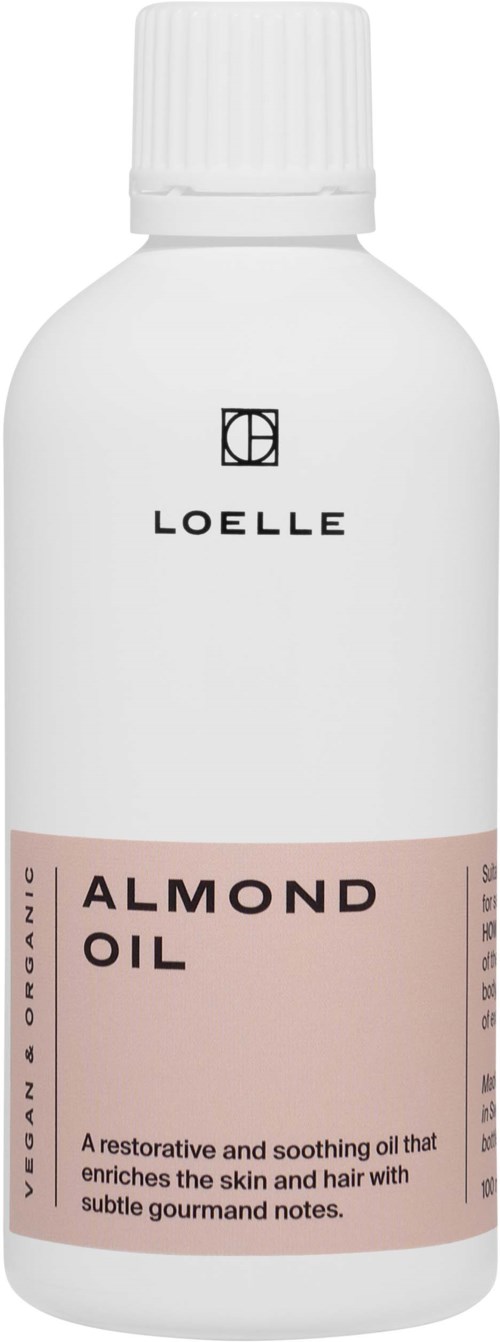 Eine weiße Flasche mit einem rosafarbenen Etikett, auf dem "Almond Oil" steht, beschreibt es als beruhigendes Haut- und Haaröl.