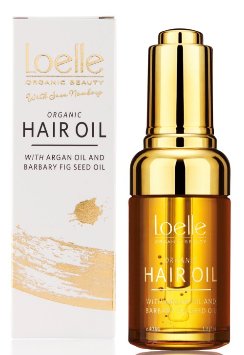 A bottle of Loelle organic hair oil with a white and gold box beside it.
