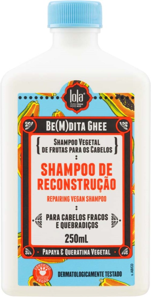 A white bottle with a blue cap labeled for vegan hair repair shampoo with papaya and vegetable keratin.