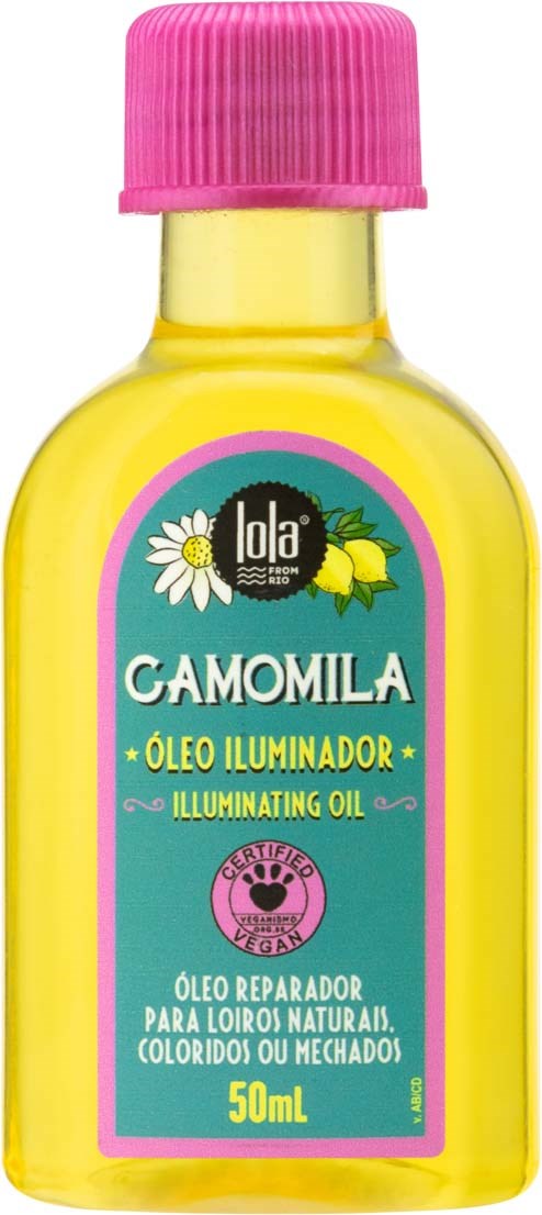 En liten gul flaska med rosa lock och en etikett som säger 'Camomila' och 'Lysande olja'.