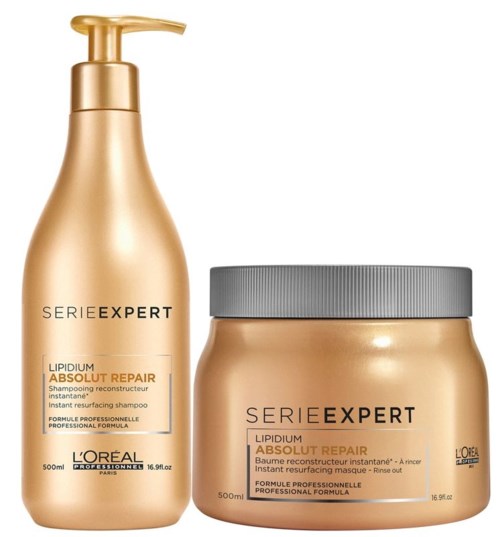 L'Oréal schampo och mask i guldflaskor, märkt 'Series Expert' och 'Absolute Repair'.