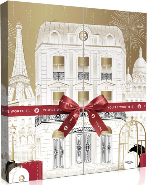 En gaveæske med Paris-tema-illustration, et rødt bånd og små parfume-flasker, der fejrer skønhed og elegance.