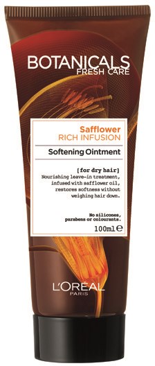 En brun tub med L'Oreal Botanicals hårsalva, märkt för torrt hår med safflorinfusion, utan silikoner eller parabener.