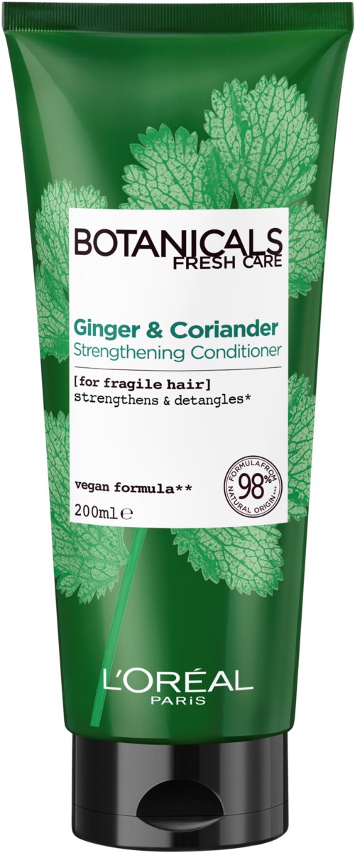 Green tube of L'Oréal Botanicals Fresh Care with ginger and coriander for fragile hair. Focus on natural ingredients.
