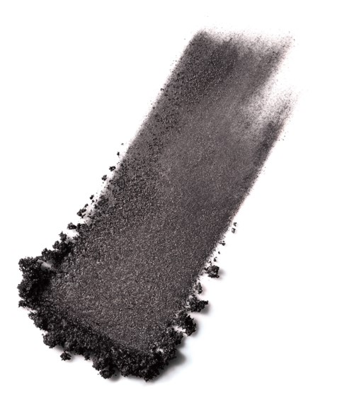 A black powder spread in a rectangular shape with a tail towards the top right.