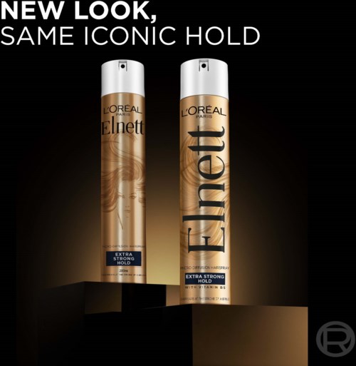 Två burkar av L'Oreal Elnett-hårspray med ny design, fortfarande märkta 'Extra Strong Hold.'
