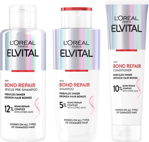 Tre forskellige hårplejeprodukter fra L'Oréal Paris Elvital, inklusive shampoo, balsam og redningsforbehandling.