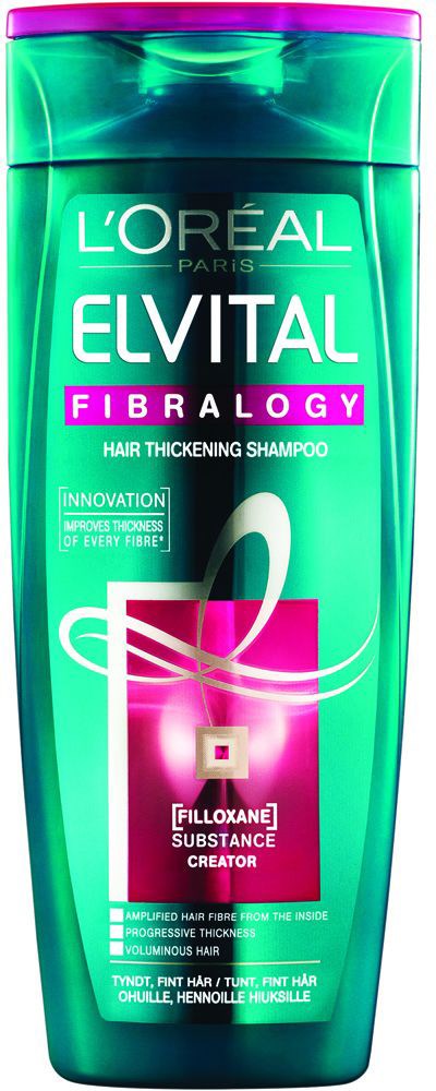 Vihreä ja violetti shampoopullo, L'Oréal-tuotemerkki, nimeltä Elvital Fibralogy hiusten paksuuden lisäämiseen ja innovaatioihin.