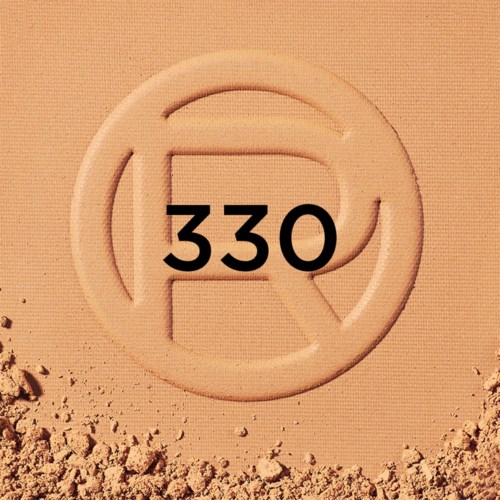 Ett runt stämpel med siffran 330 i mitten, på en sandig yta.