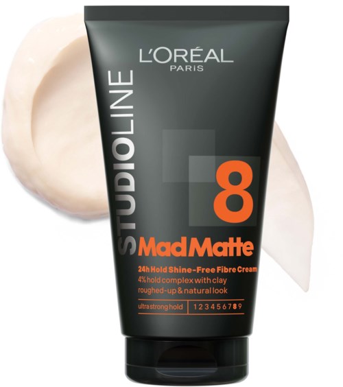 En sort tube af L'Oréal Mad Matte 24-timers hårstylingcreme, med orange og grå tekst, og lidt creme ved siden.