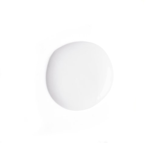 A white, round pill on a white background.